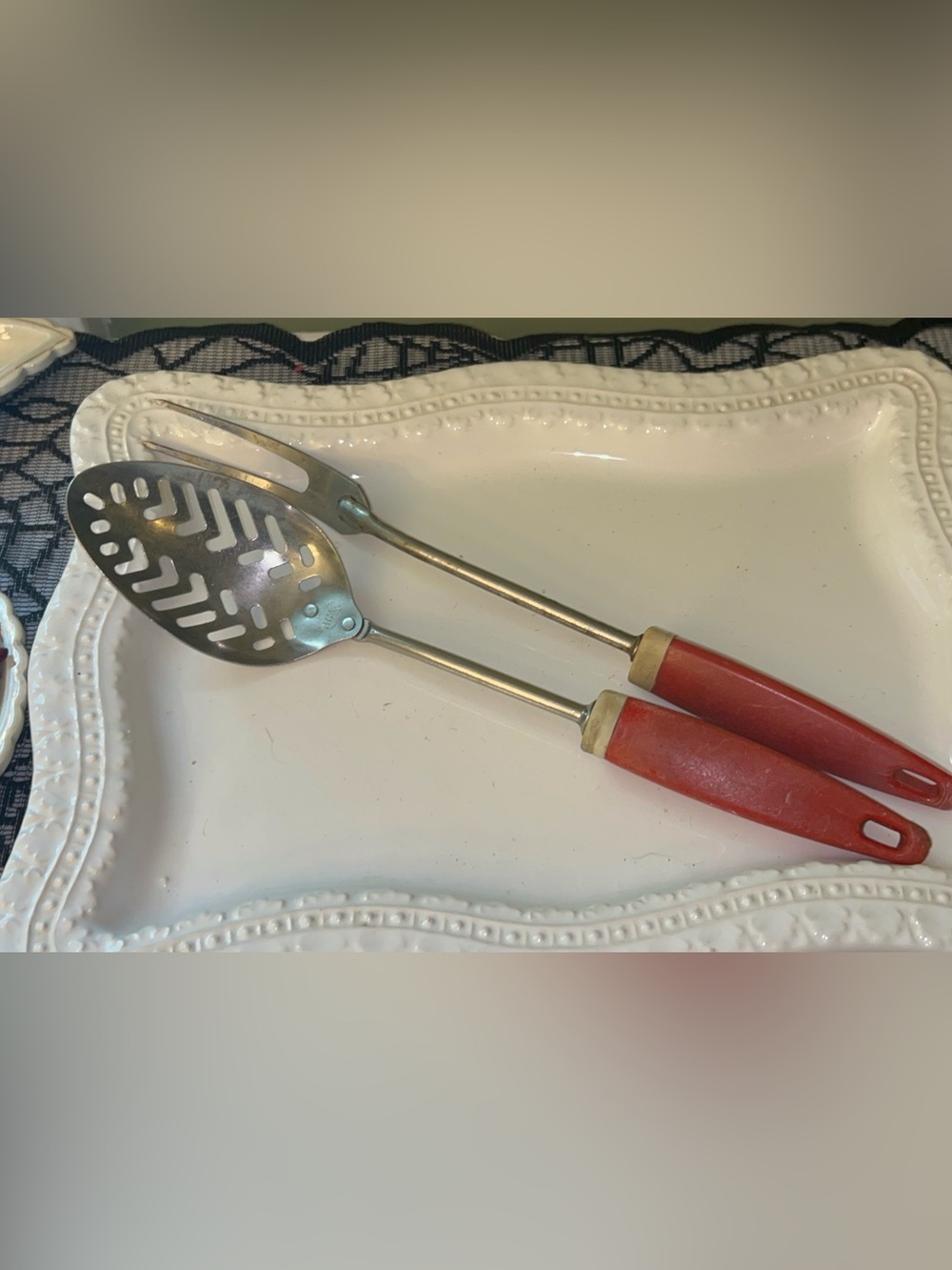 A&J/Ekco stainless steel slotted spoon and matching serving fork with red handle